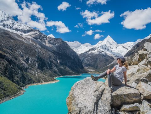 athletic woman lounging by mountains